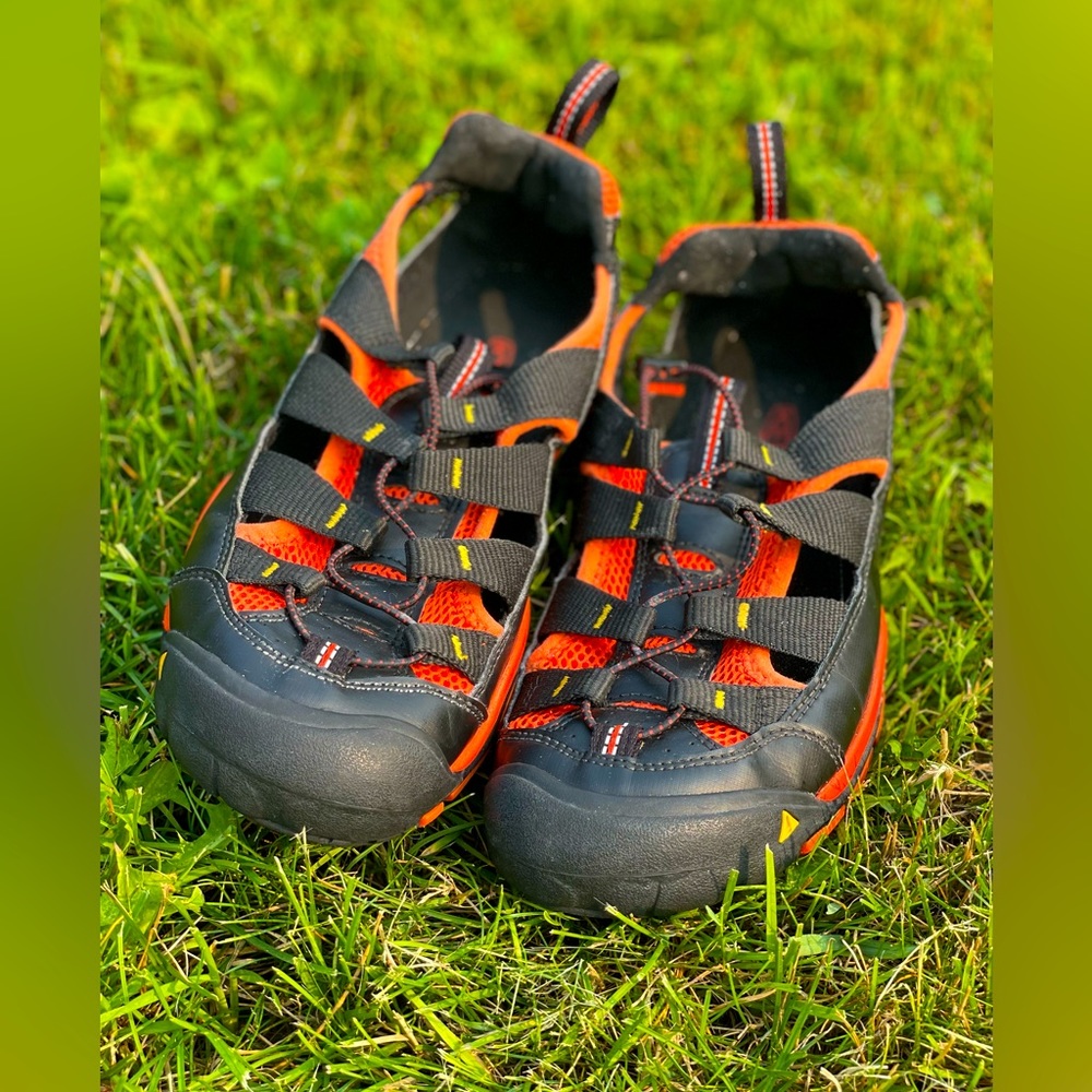 Keen, outdoor sandals beautiful, dark, black, and orange color.